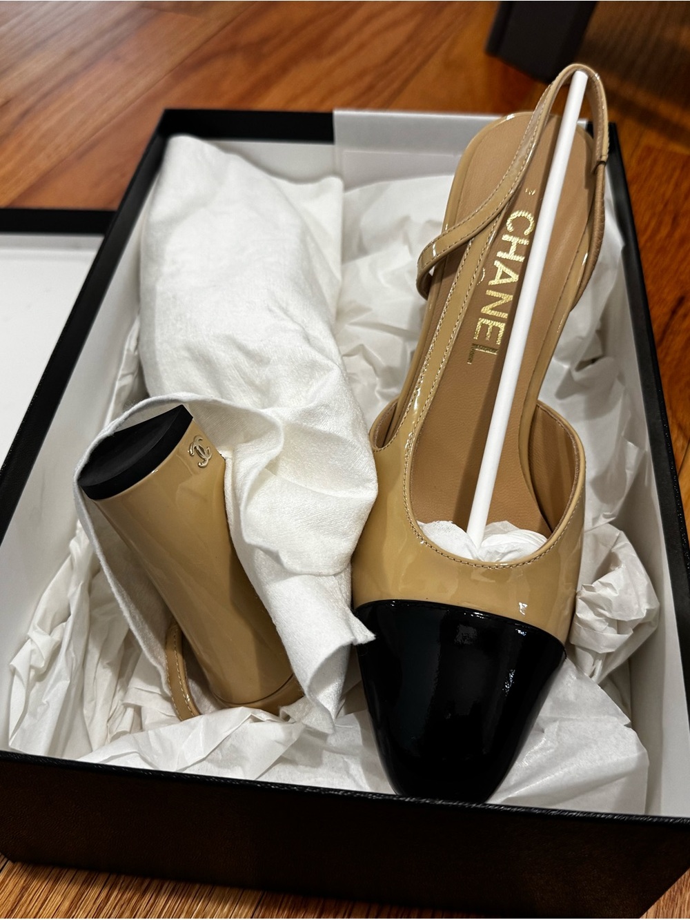 CHANEL Two-Tone Patent Leather Slingback Pump in Cream and Black